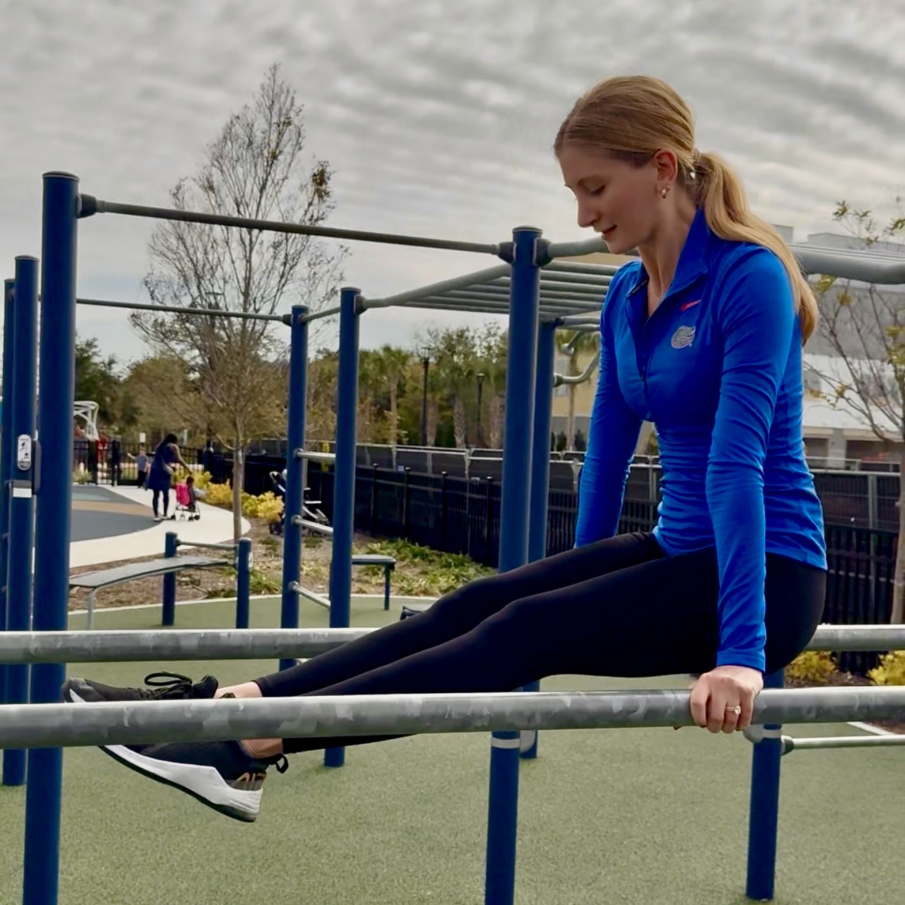 Female JaxBars athlete training on bars