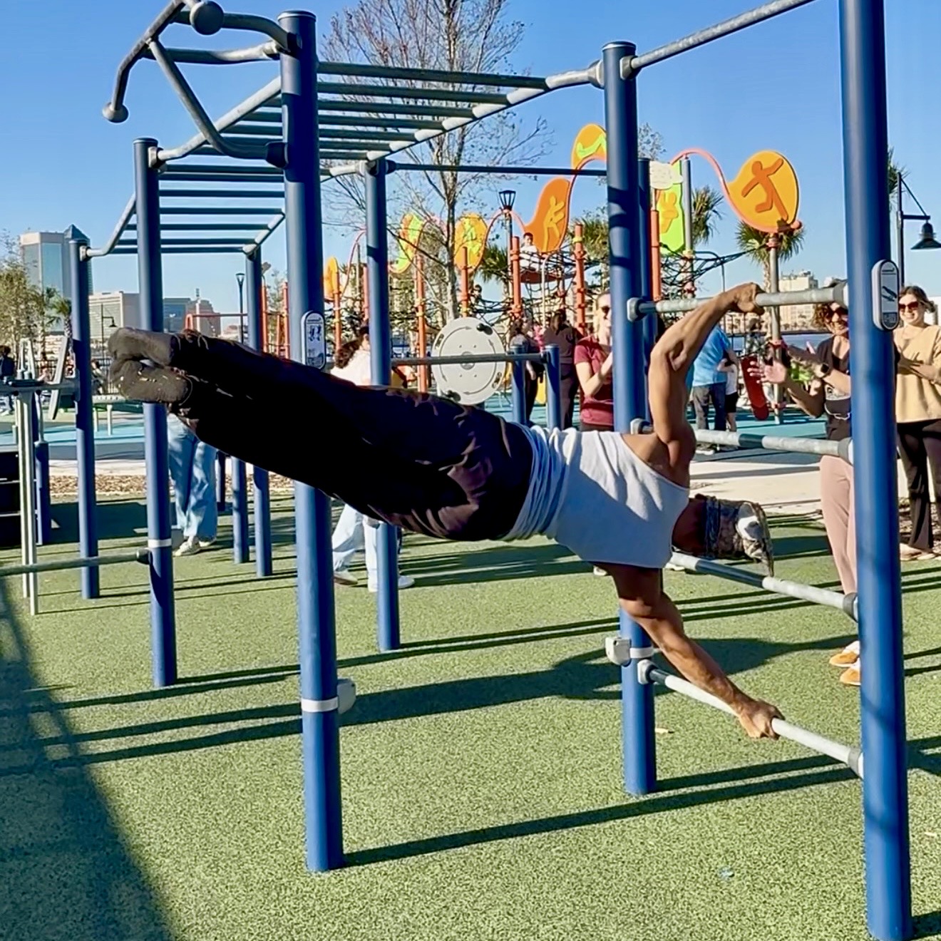 JaxBars athlete moving dynamically on bars